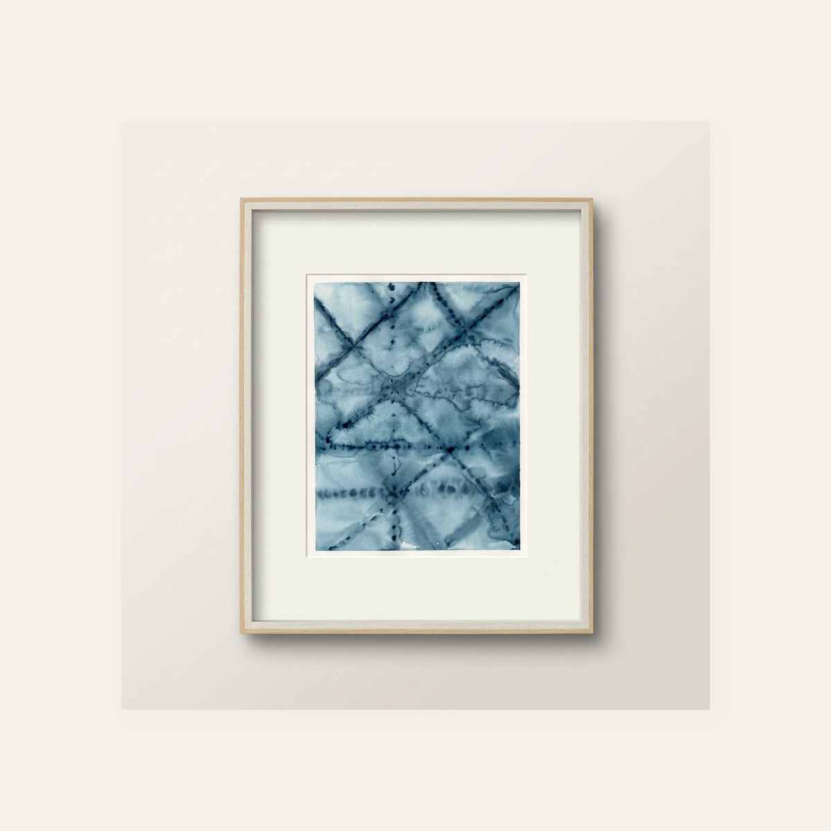 Framed abstract indigo watercolor with a soft crosshatched lattice pattern