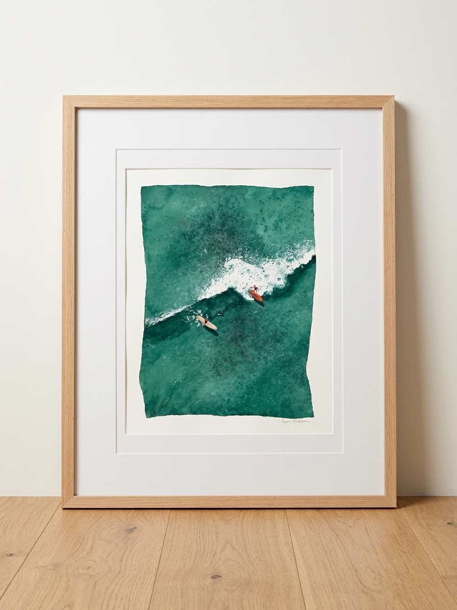 Framed aerial watercolor of two surfers beside a breaking wave in green water