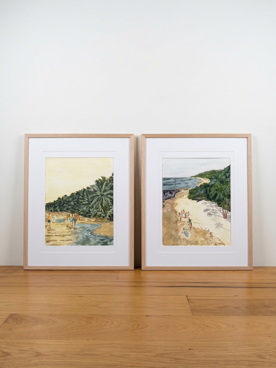 Pair of framed watercolors of beachgoers along a palm-lined shoreline