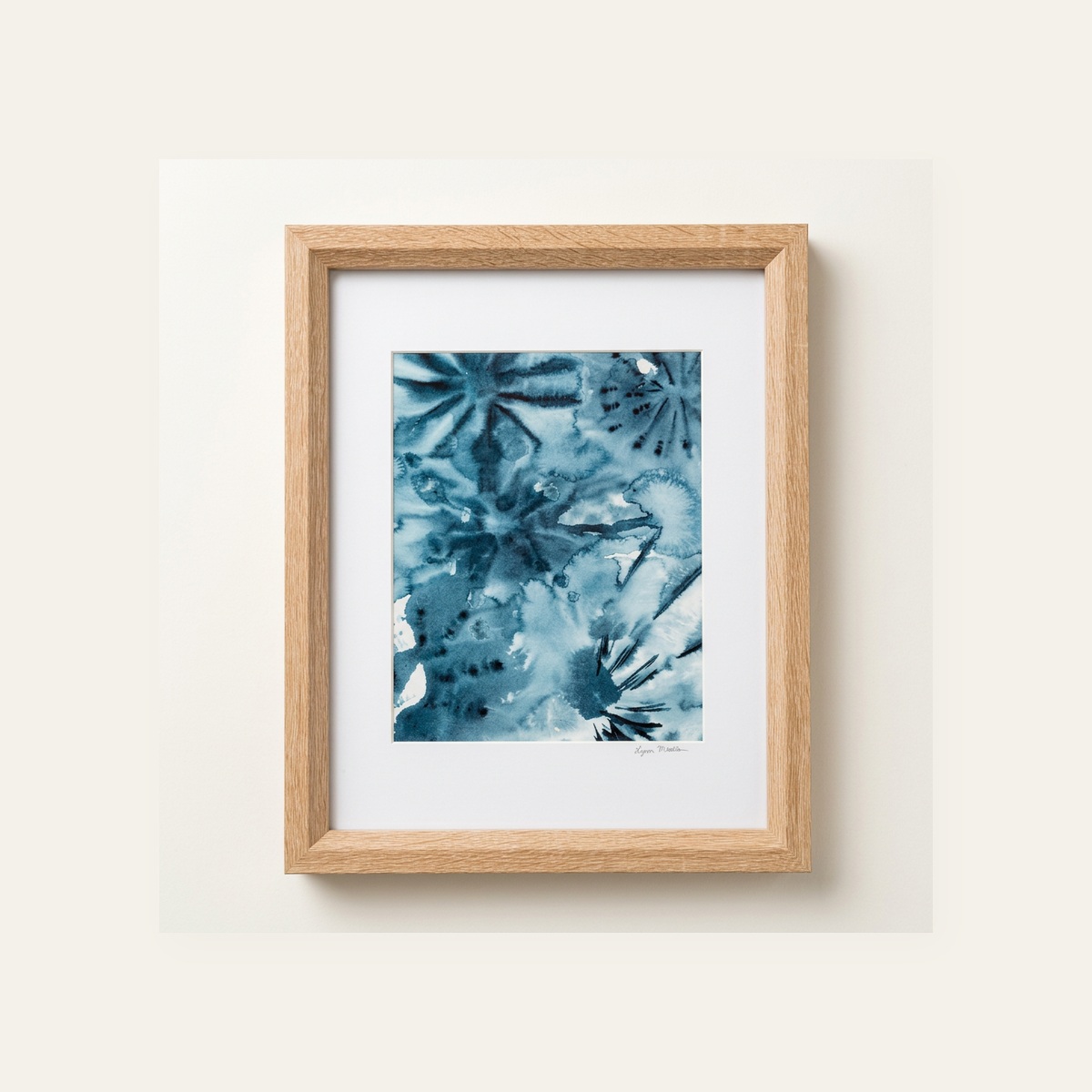 Framed abstract indigo watercolor with soft starburst blooms