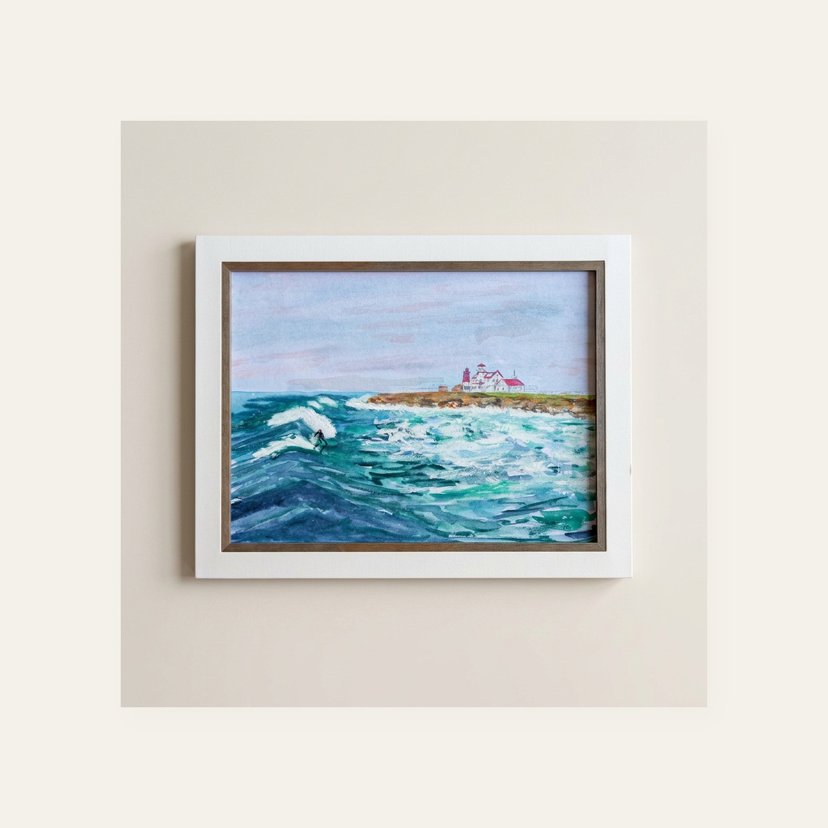 Framed watercolor of a surfer riding a wave with the Point Judith lighthouse in the distance