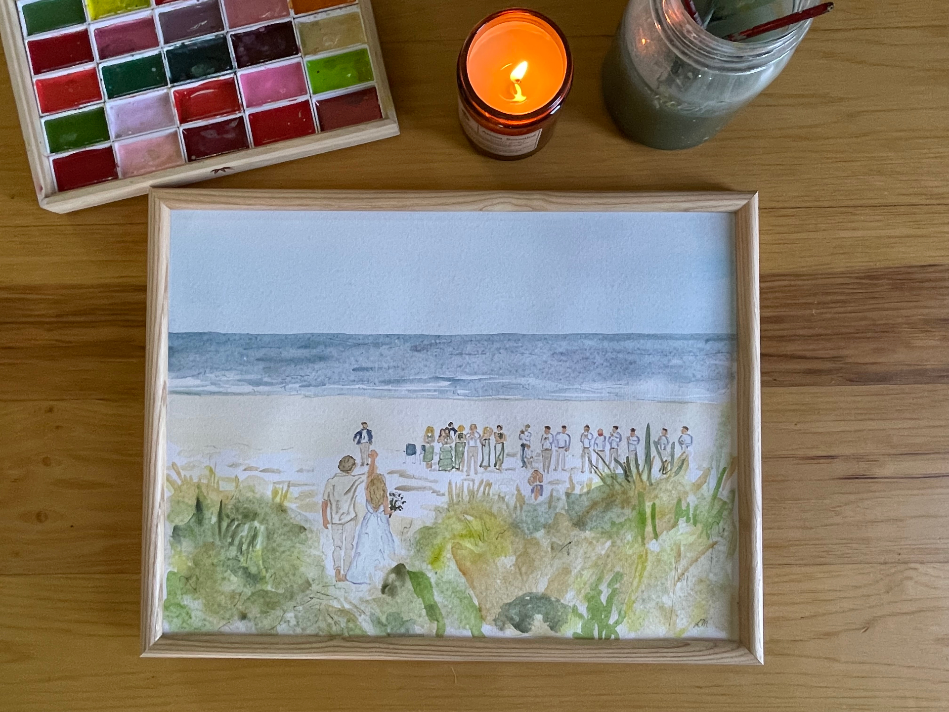 Framed watercolor of a beach wedding ceremony from the dunes
