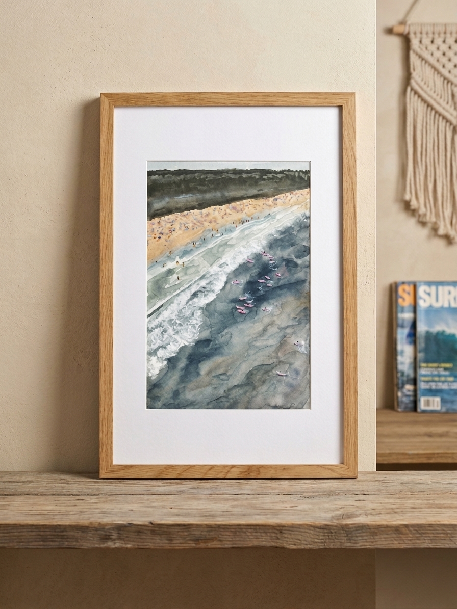 Framed aerial watercolor of Narragansett Beach with surfers beyond the breaking waves