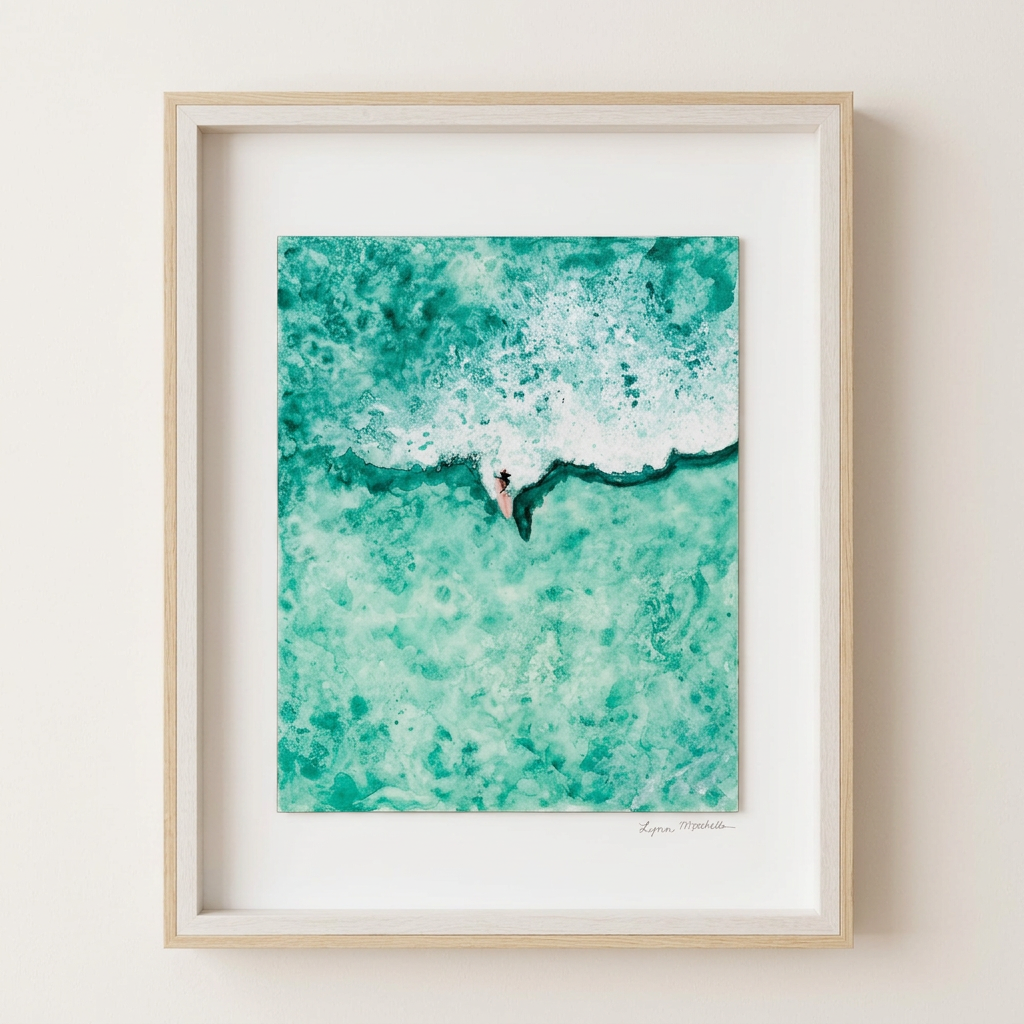 Framed aerial watercolor of a lone surfer paddling through emerald green whitewater