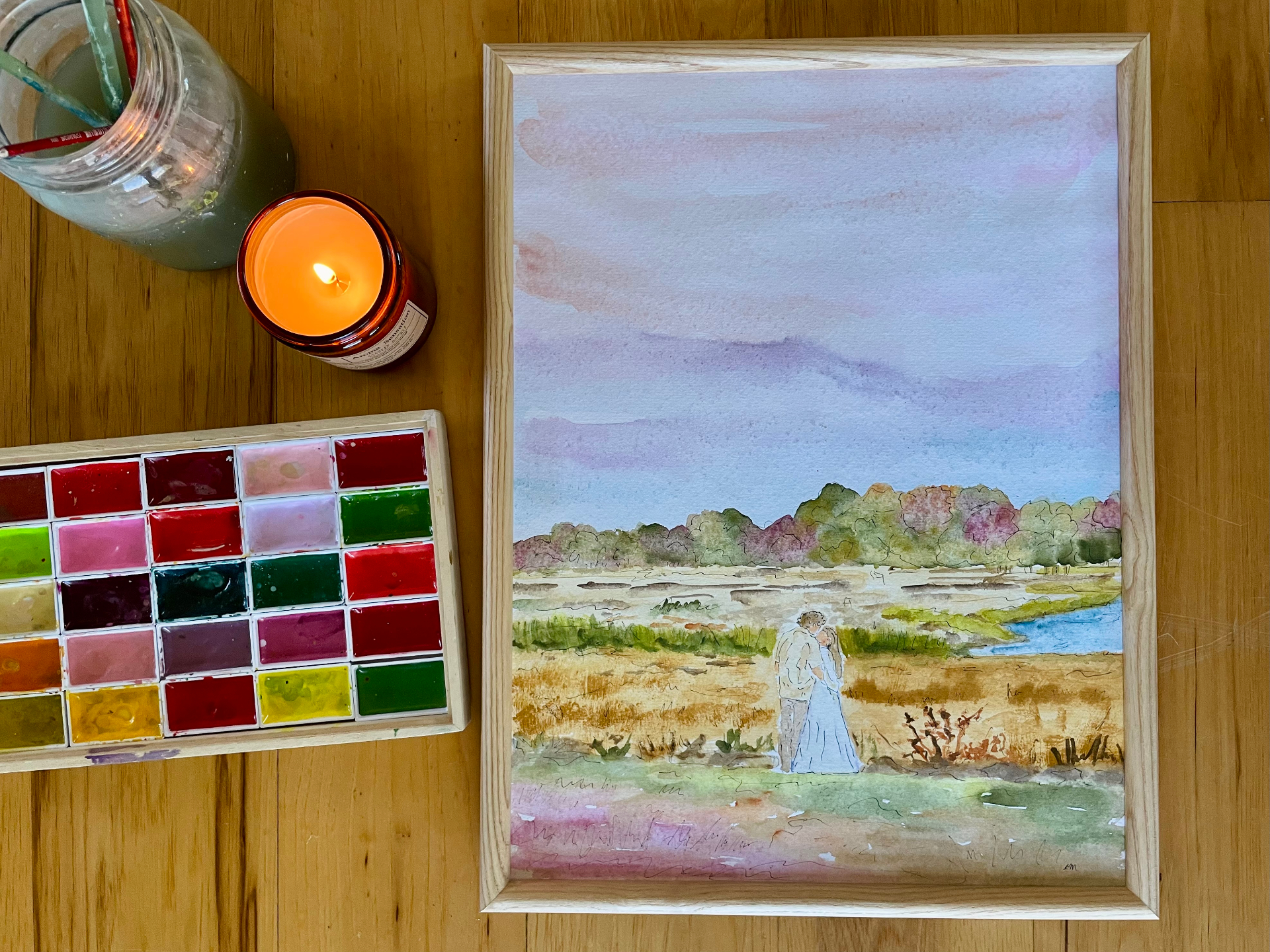 Framed watercolor of a couple sharing a moment in a sunlit marsh
